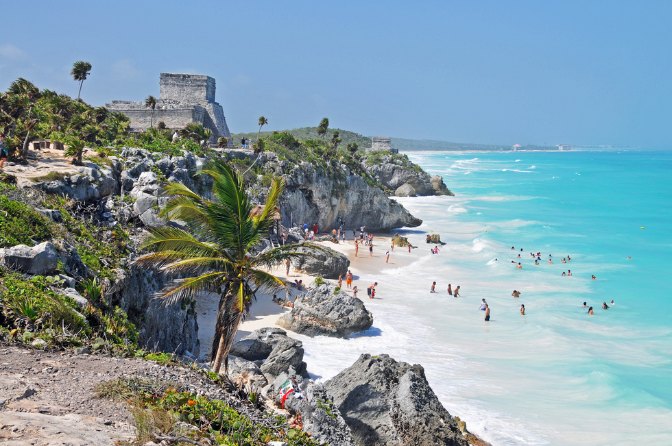 The ruins of Tulum on a cliff overlooking the beach