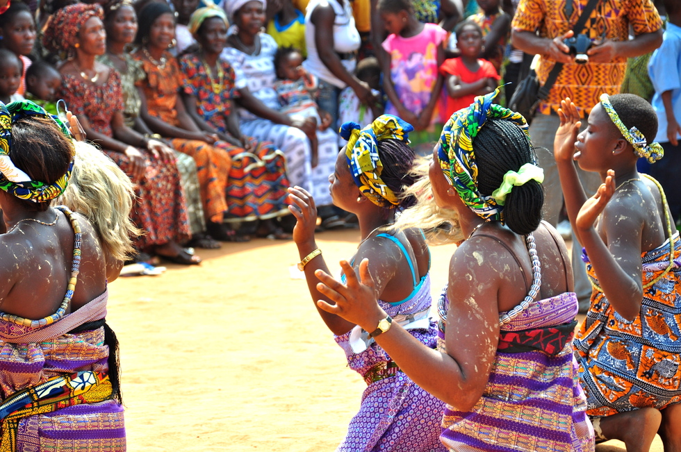 Women in Ghana perform a traditional dance