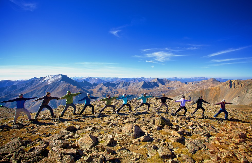 Yoga practitioners at the top of Mount Oxford, near Boulder, Colorado