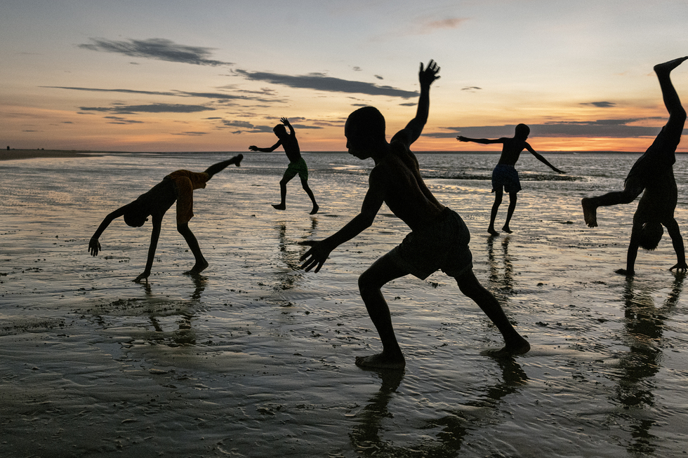 Photography from the book "In Search of Elsewhere: Unseen Images": Boys play on the beach in Belo sur Mer, Madagascar, 2019