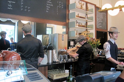 Stumptown Coffee, which adjoins the lobby of New York City's Ace Hotel, has baristas clad in dapper uniforms and caps.