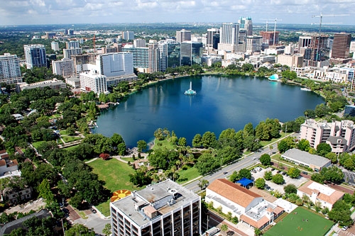 Lake Eola Park is a popular destination in the downtown Orlando area, with many people taking advantage of the beautiful surroundings.