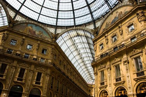 The Galleria Vittorio Emanuele II is a covered double arcade formed of two glass-vaulted arcades at right angles intersecting in an octagon; it is prominently sited on the northern side of the Piazza del Duomo in Milan, and connects to the Piazza della Scala