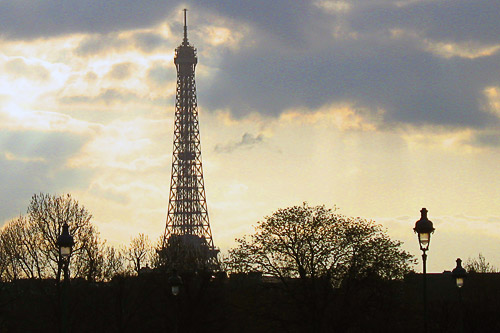 Silhouette of the Eiffel Tower as the sun sets in early April.