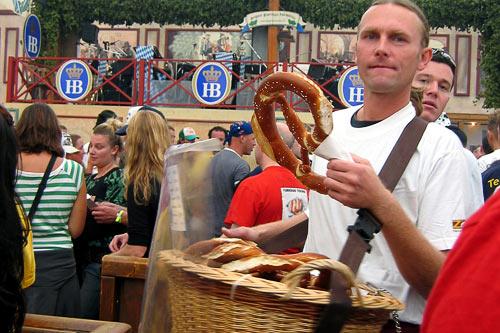 A vendor sells <em>brezel</em> (a giant soft pretzel) by the basket.