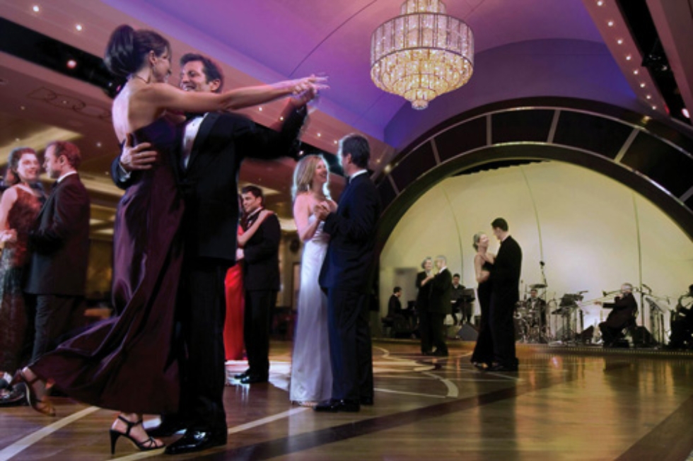 Guests dancing in the Queen Mary 2 Queens Room.