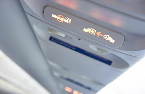 No smoking and seat belt signs on an airplane