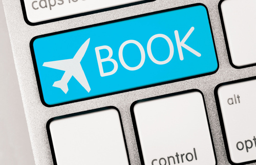Illustration of airfare booking button on a computer keyboard