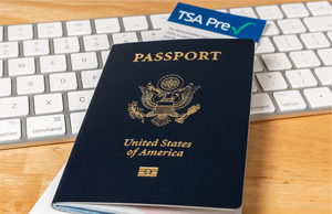 U.S. passport, keyboard, TSA PreCheck form