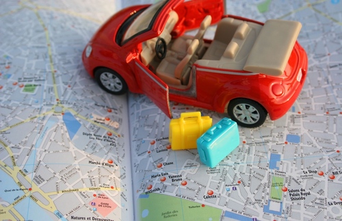 toy car on map of Paris (photo illustration)