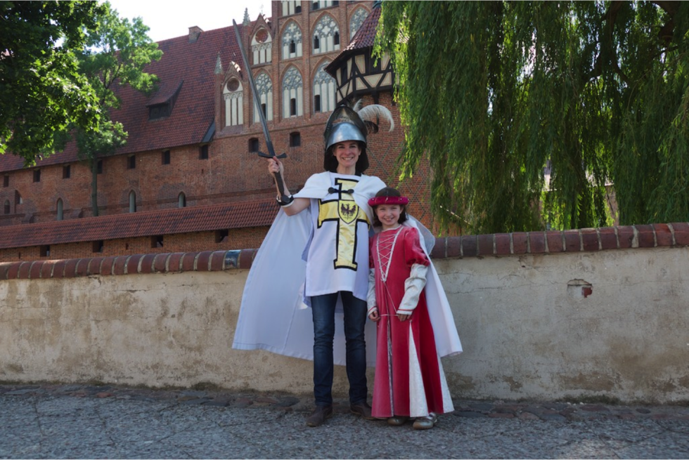 Malborg Castle, outside of Gdansk, Poland, is the largest brick castle in the world. Here, the author and her daughter dress up as medieval residents of the castle