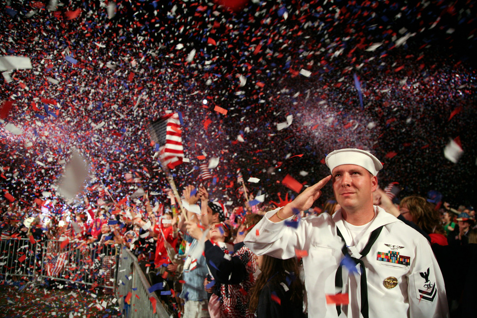 A Navy man salutes at a Fourth of July celebration in Boston