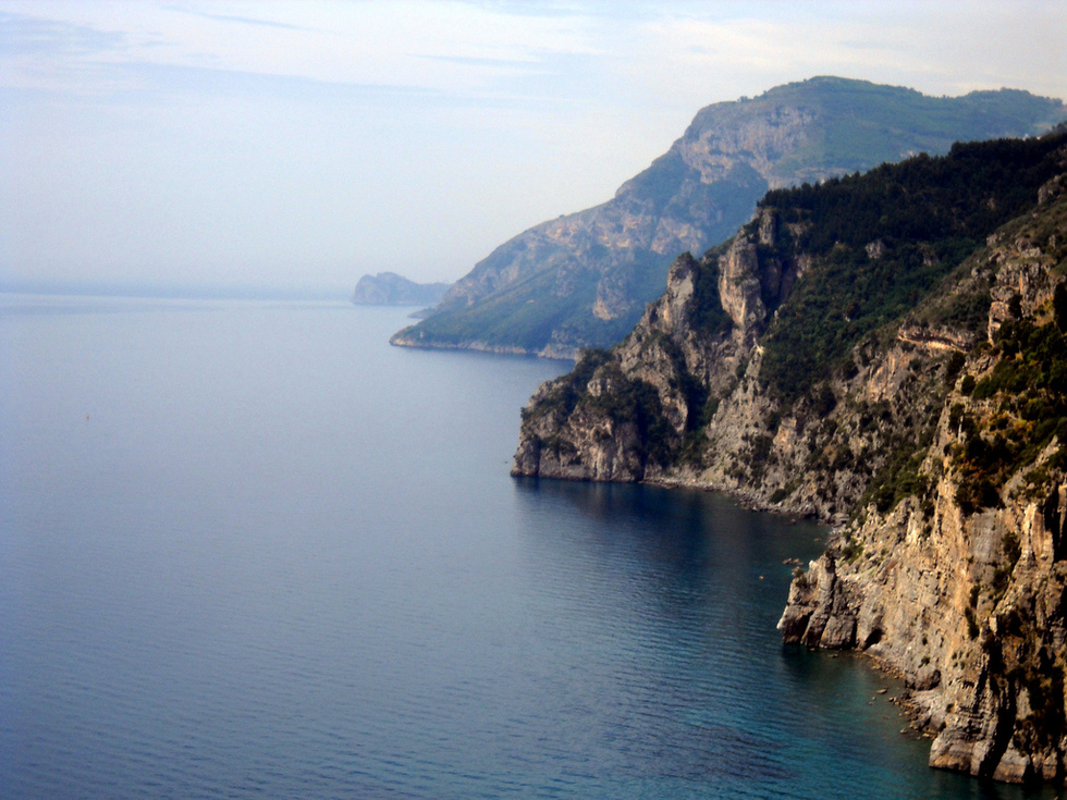 Rock cliffs and the Mediterranean sea along the Amalfi Coast of Italy. 