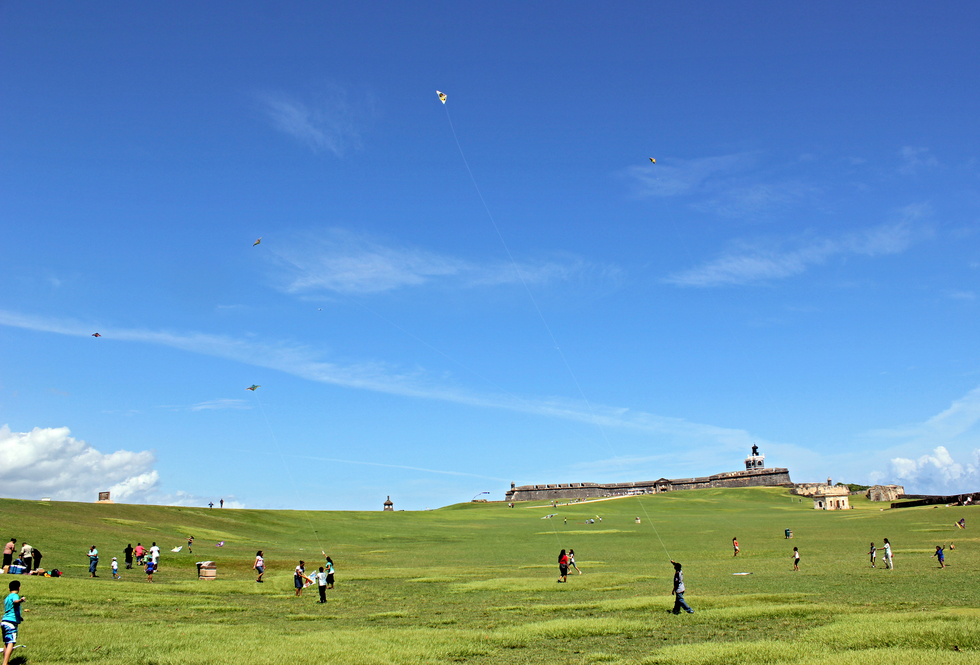 Locals enjoy a breezy Saturday morning by flying kites at El Morro Park.