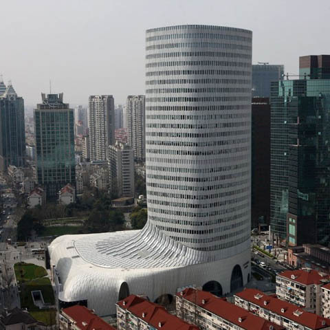 The new luxury shopping complex in Shanghai resembles a foot set firm in the ground. 