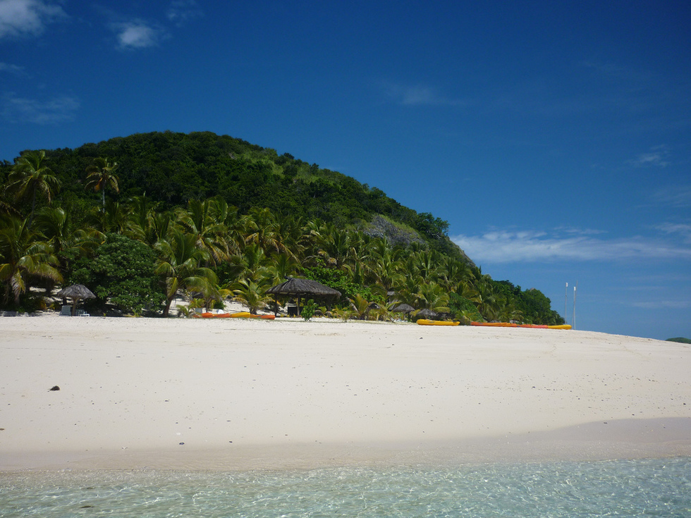 White beaches leading up to tropical forest.