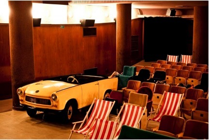 Unconventional seating at the Bio Oko movie theater: beach chairs and a car.
