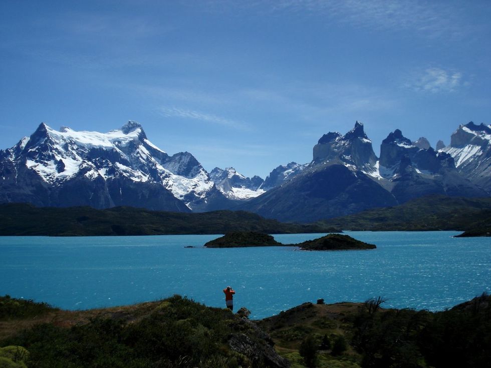 The towering Cuernos over a beautiful blue lake in Patagonia's Torres del Paine National Park