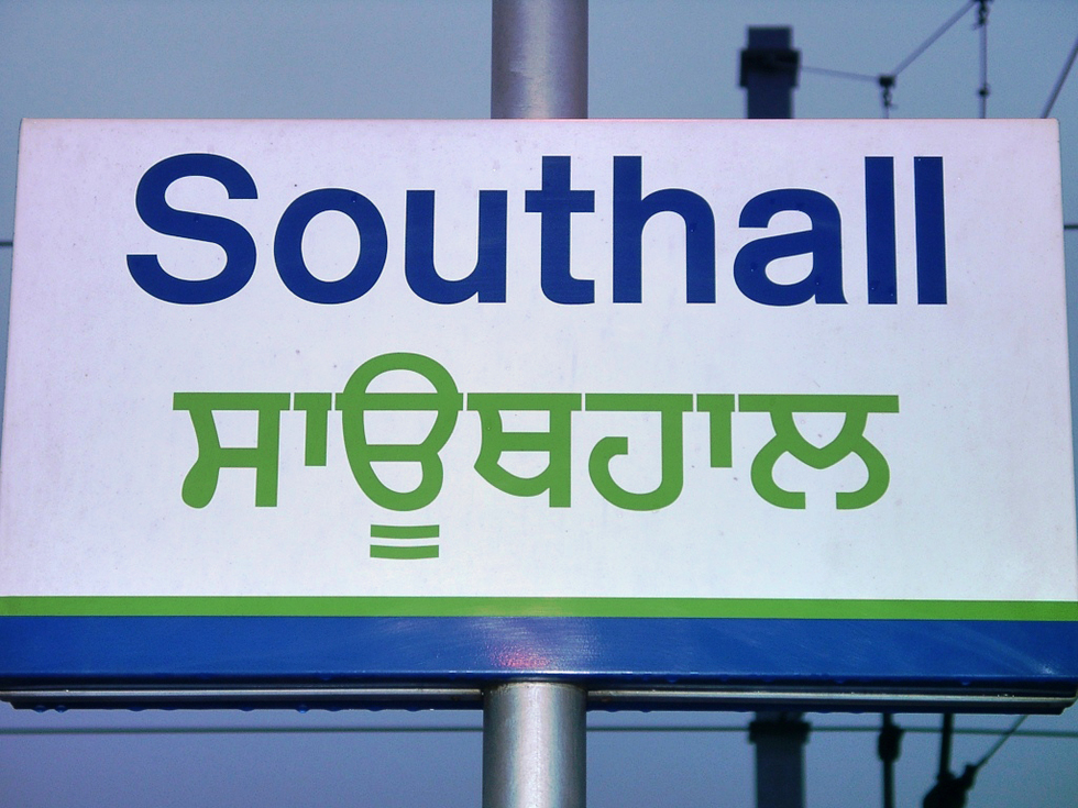 A metro sign with Hindi translation in Southall.