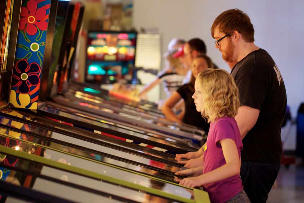 Players hit the pinball machines at the Pinball Hall of Fame