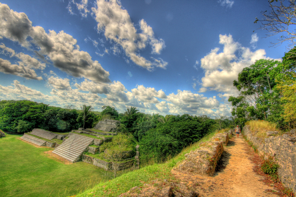 A visitor surveys the ancient Mayan temple Tun Ha in Belize
