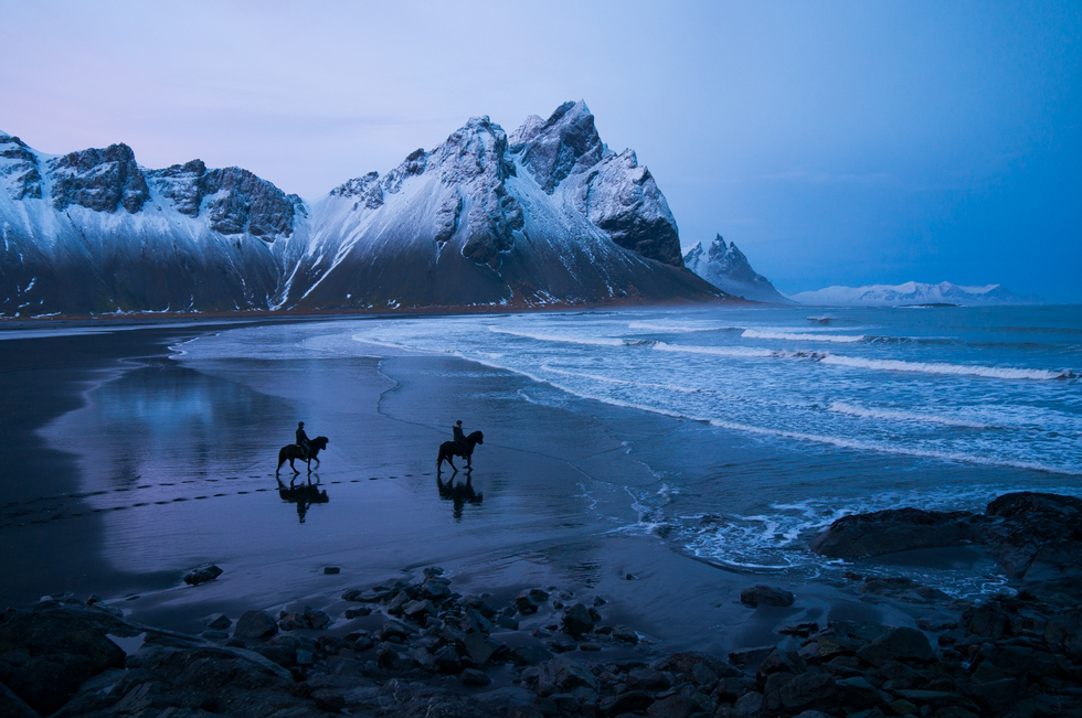 Horseback riding on beach at Hofn, Iceland