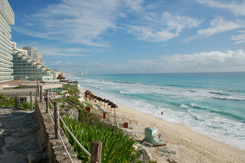 High rise hotels back a beach in Cancun