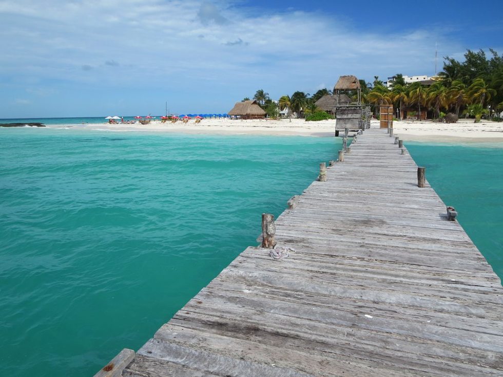 A pier juts from the beach at Isla Mujeres