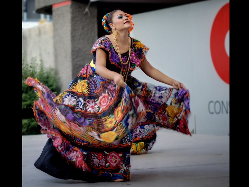 A dancer kicks up her heels in Mérida, Mexico