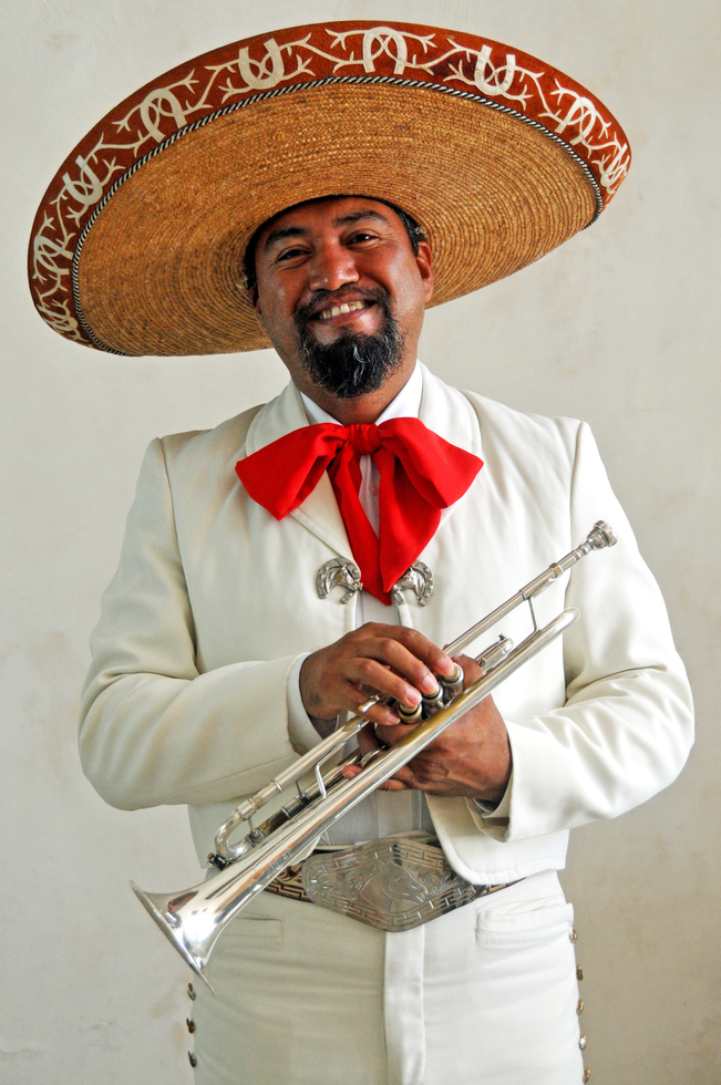 The portrait of a mariachi musician with his trumpet