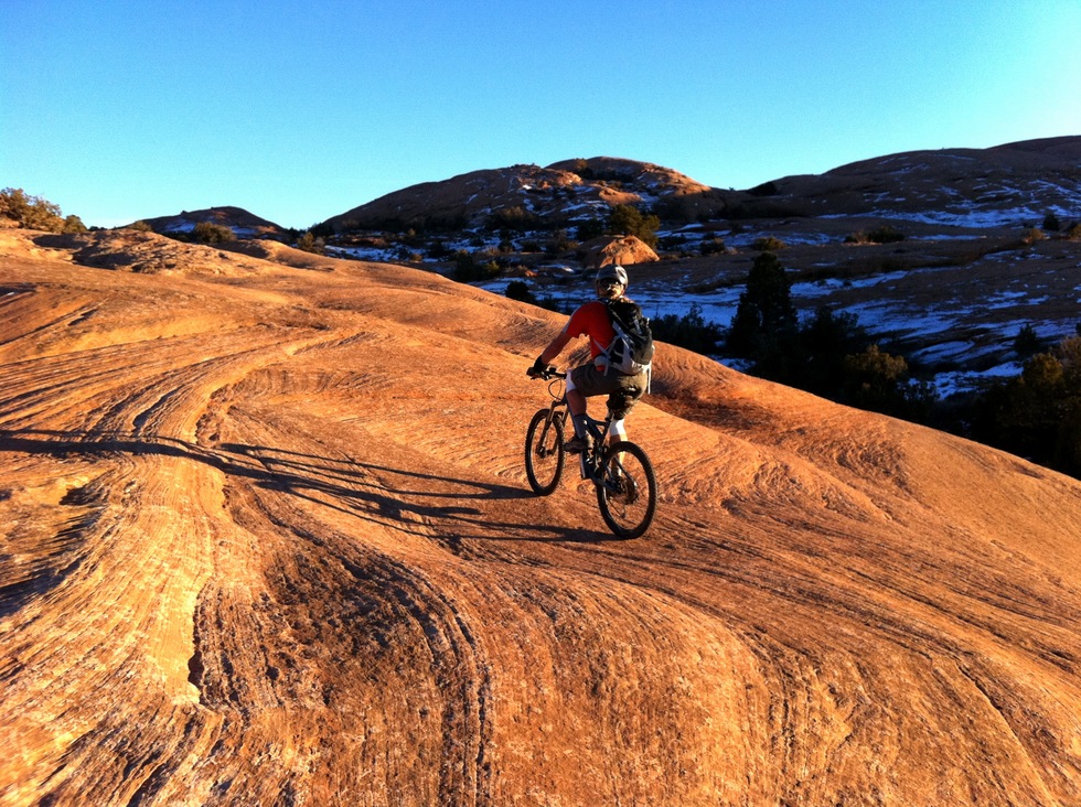 A photo of a biker on the Slickrock trail