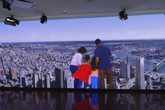 A video of a family looking at New York City from the One World Observatory at the Freedom Tower