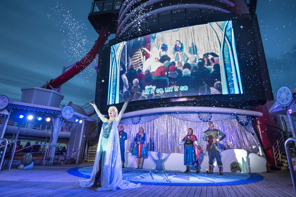 Frozen characters party on Disney Wonder's deck. 