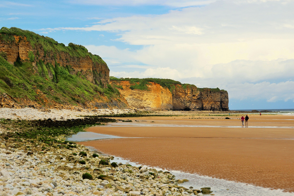 The D-Day beach, Omaha Beach, with cliffs in the background in Normandy, France. 