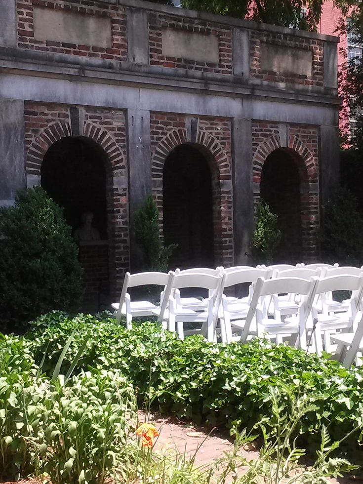 The Edgar Allan Poe Museum garden with lawn chairs set out for events.