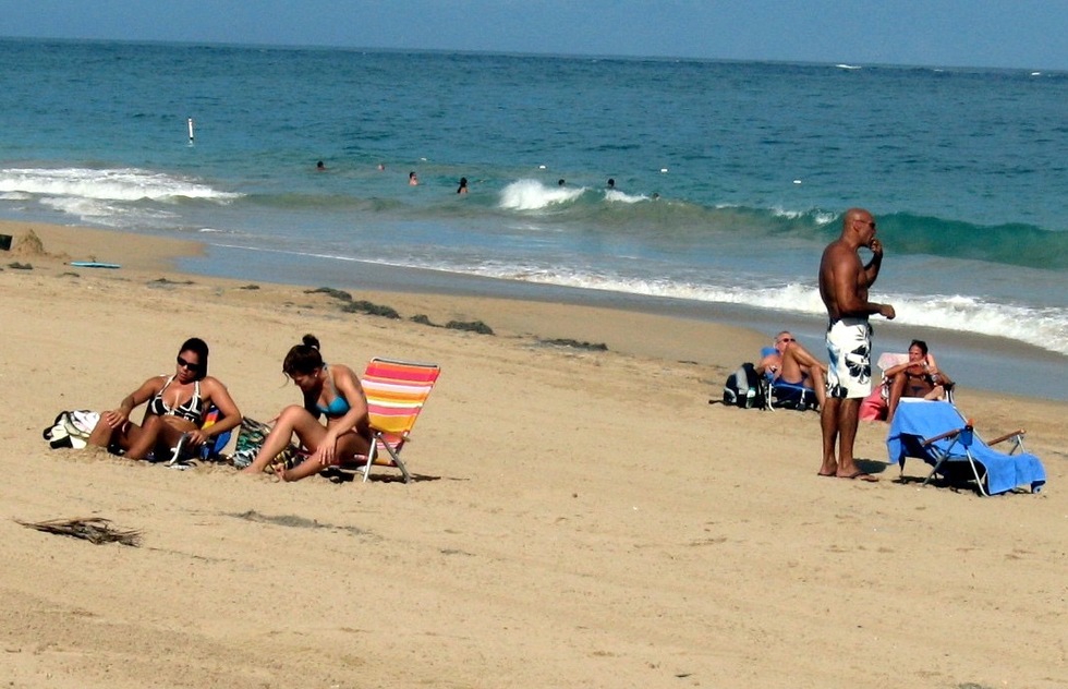Sunbathers at Ocean Park beach in Puerto Rico.