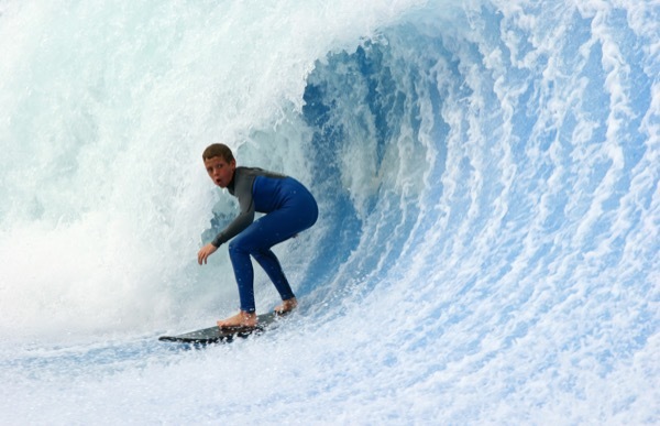 A young surfer catches a wave off San Diego.