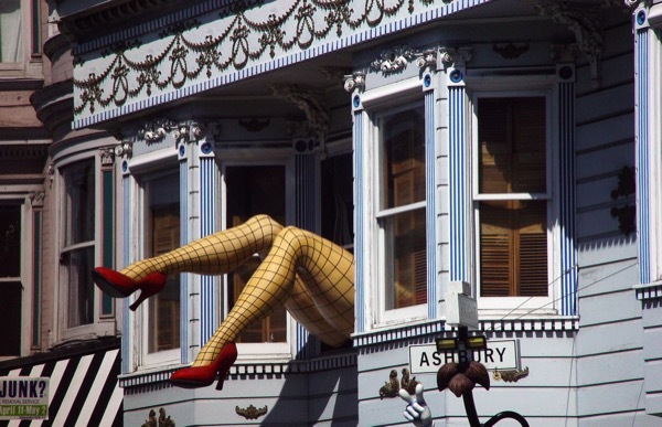 A leg sculpture protrudes from a windo in the Haight, San Francisco