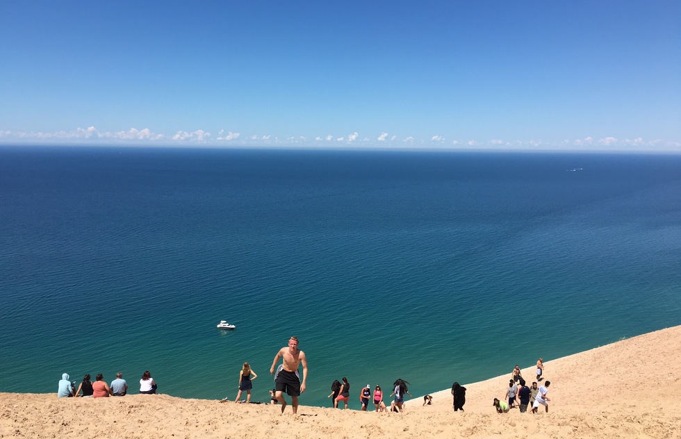 Vacationers trudge up the dunes at Sleeping Bear Dunes National Lakeshore