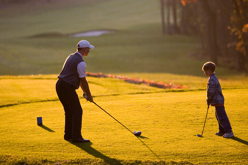 A father and son play golf at Wintergreen ski resort