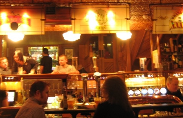 Warmly lit interior of The Porterhouse pub in Dublin