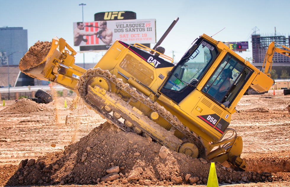 A student learns to drive a bulldozers at Dig This! in Las Vegas