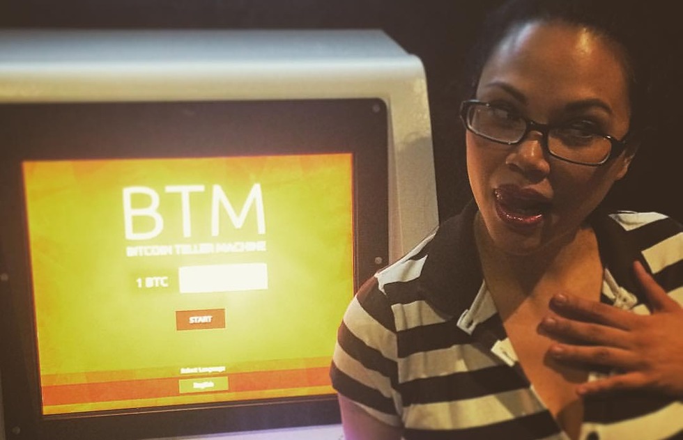 A woman at a Bitcoin ATM in Las Vegas 