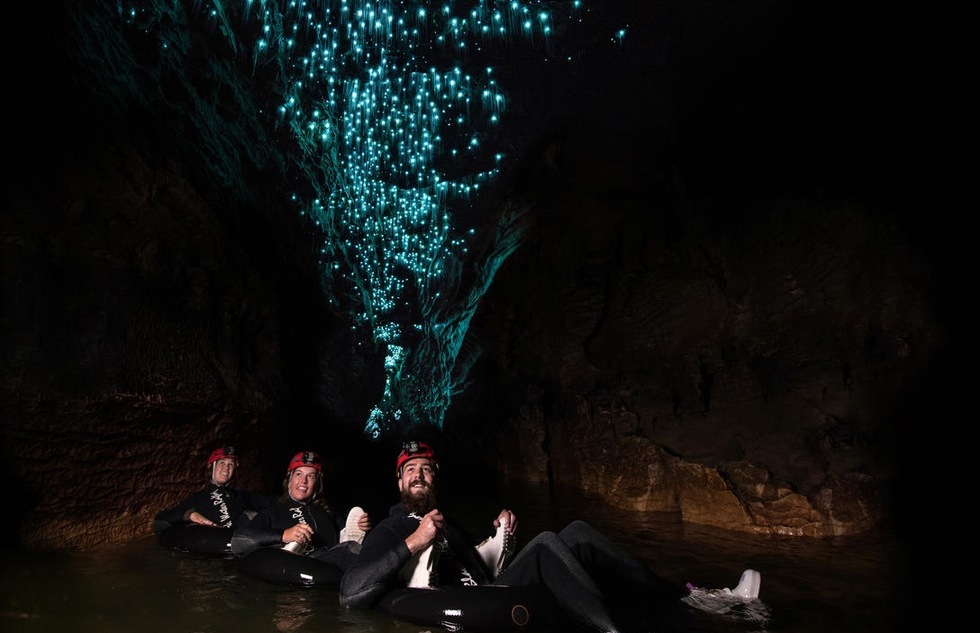 Tubers drift under phosphorescent glowworms inside the Waitomo Caves in New Zealand.
