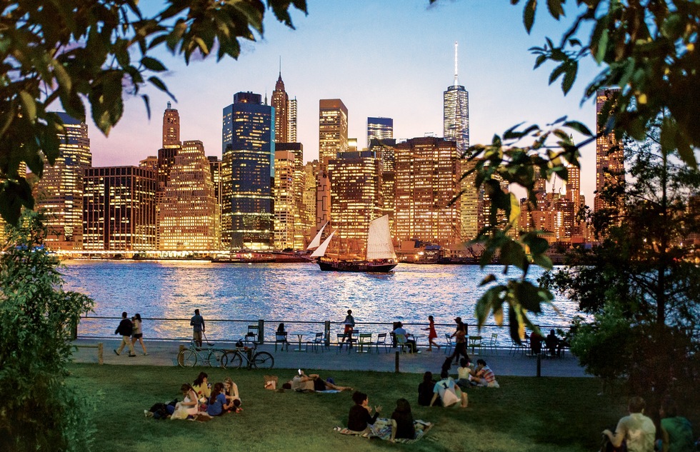 Glittering view of Lower Manhattan from Brooklyn Bridge Park in New York City