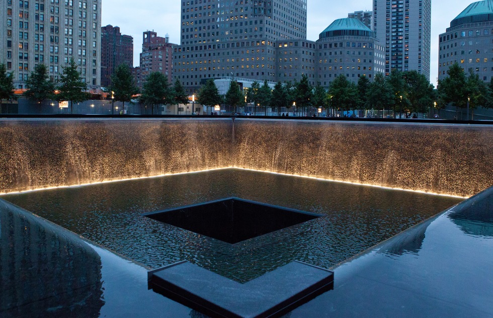 A reflecting pool and waterfall in the footprint of one of the Twin Towers at Memorial Plaza in Manhattan