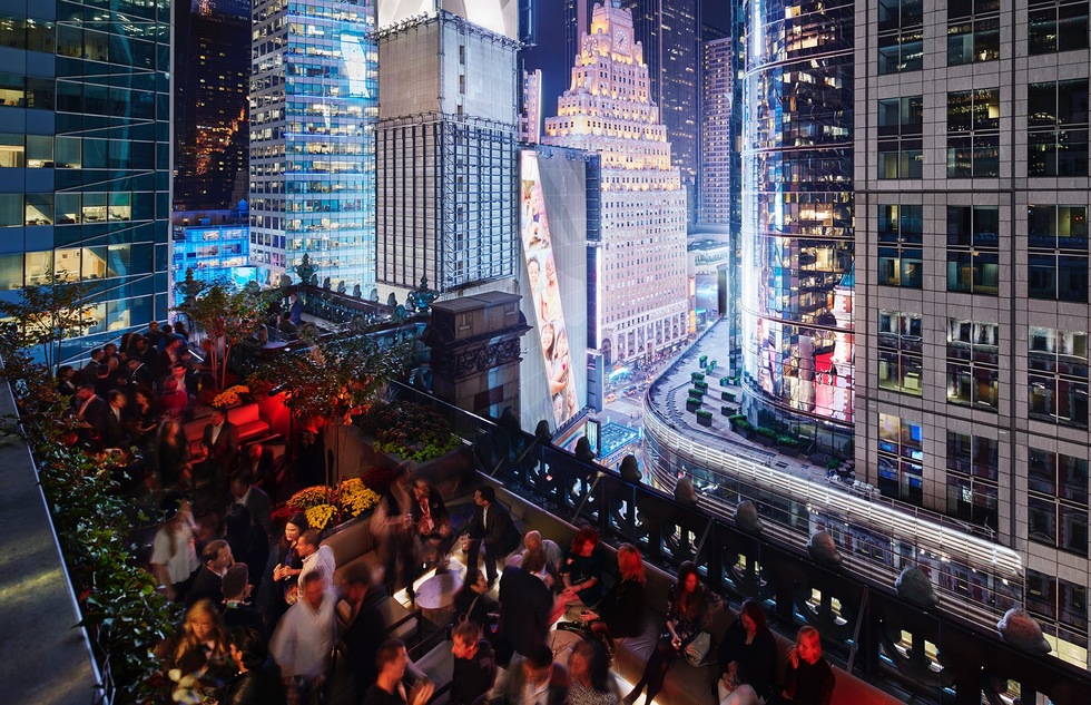 Revelers at St. Cloud, the rooftop bar at the Knickerbocker Hotel in Times Square