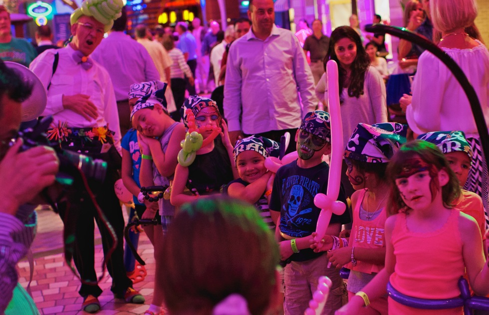Children in an onboard parade on Oasis of the Seas.