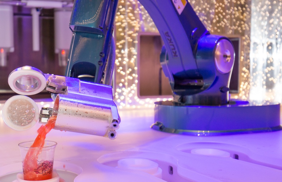 A robotic bartender pours a drink aboard Royal Caribbean's Harmony of the Seas
