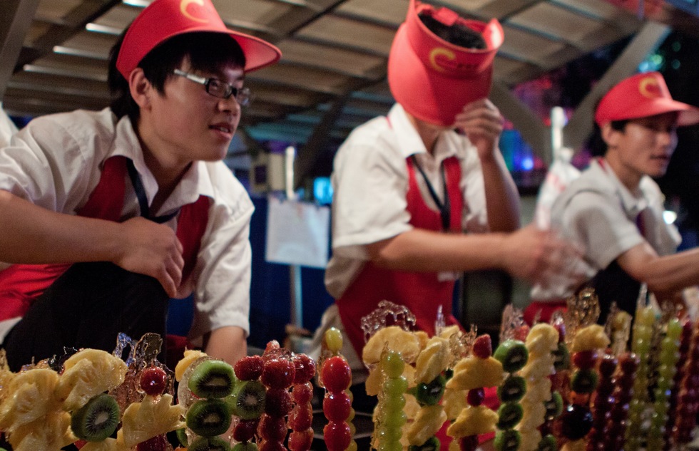 Fruit vendors at Wangfujing Snack Street in Beijing